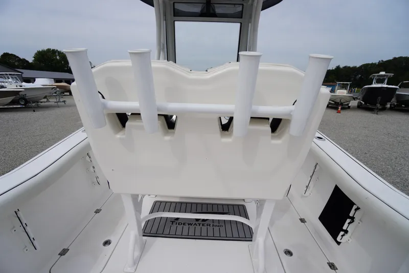 Slide: The Image of 2021 Tidewater 256 CC Adventure boat interior with rod holders and non-slip mat. - 37