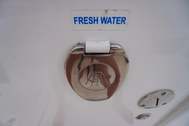 Slide: The Image of Fresh water access on 2021 Tidewater 256 CC Adventure boat. - 38