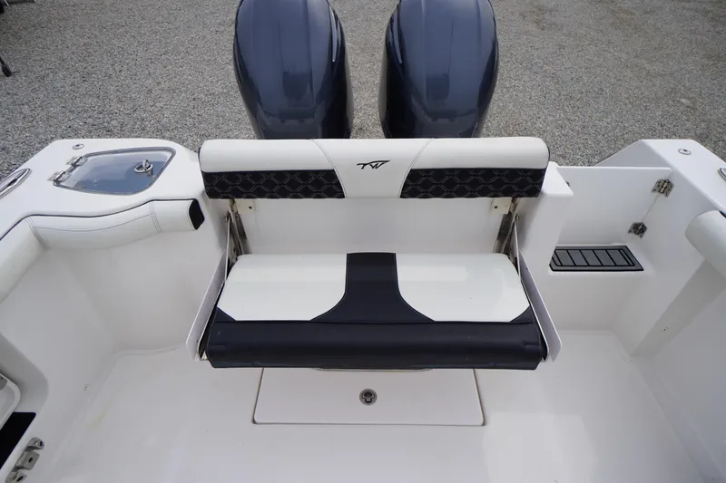 Slide: The Image of 2021 Tidewater 256 CC Adventure boat with dual engines and foldable rear seat. - 41