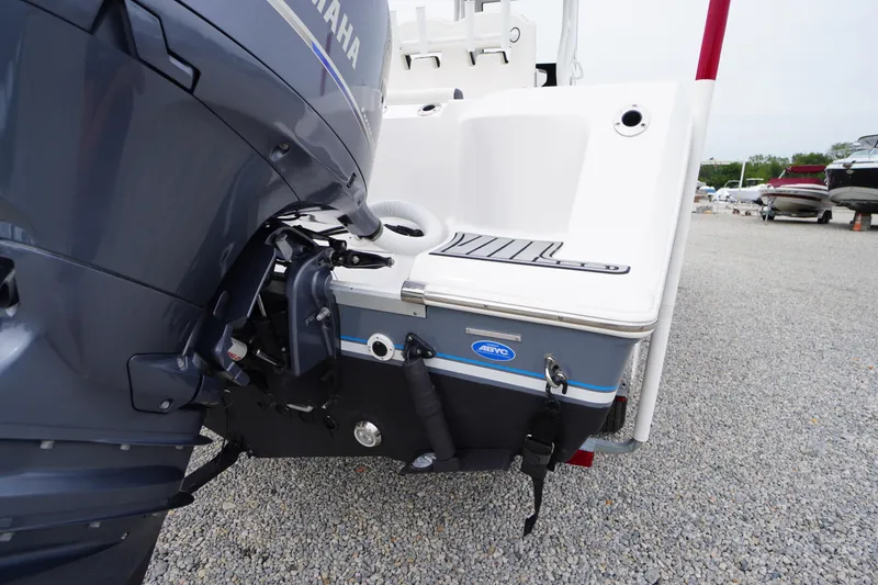 Slide: The Image of 2021 Tidewater 256 CC Adventure boat with Yamaha engine, rear view on gravel lot. - 64