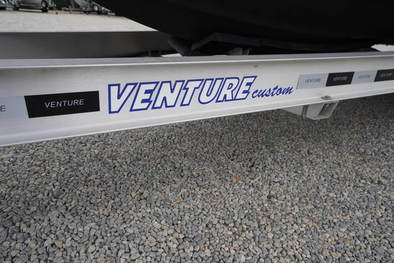 Slide: The Image of Trailer with "Venture Custom" branding for 2021 Tidewater 256 CC Adventure boat. - 66