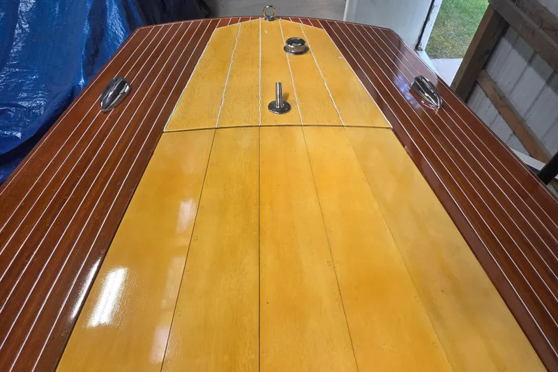 Slide: The Image of 1960 Custom Chris Craft 19 Capri boat deck with polished wood finish. - 15