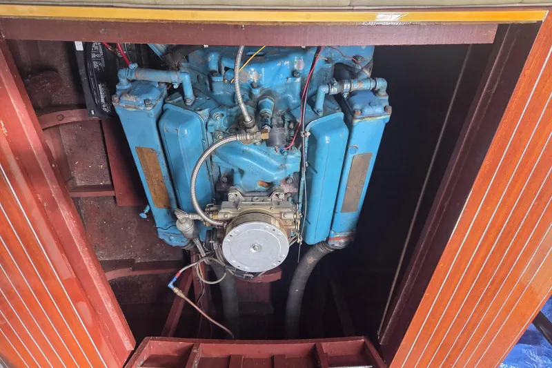 Slide: The Image of 1960 Chris Craft 19 Capri engine, blue, in wooden compartment. - 20