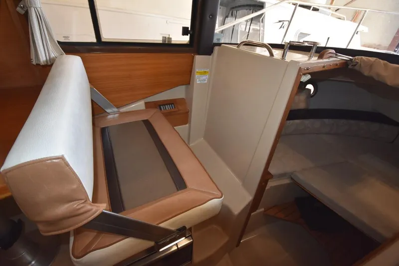 Slide: The Image of Interior of 2018 Ranger Tugs R-23 boat with seating and cabin area. - 29