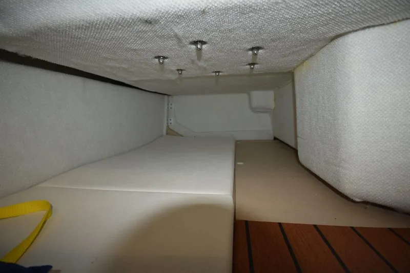 Slide: The Image of Interior view of 2018 Ranger Tugs R-23 boat cabin with cushioned seating. - 32