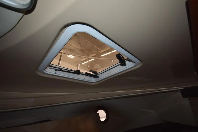 Slide: The Image of Interior view of 2018 Ranger Tugs R-23 boat, featuring a ceiling hatch. - 37