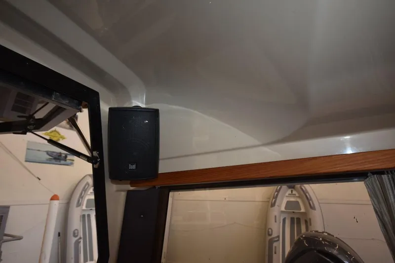 Slide: The Image of Interior of 2018 Ranger Tugs R-23 boat with mounted speaker and window view. - 39