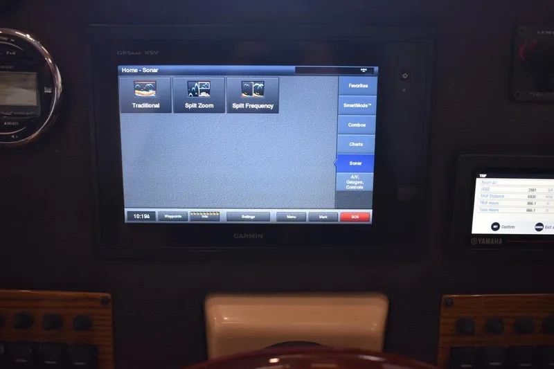 Slide: The Image of Dashboard of a 2018 Ranger Tugs R-23 with Garmin sonar display and Yamaha trip data. - 46