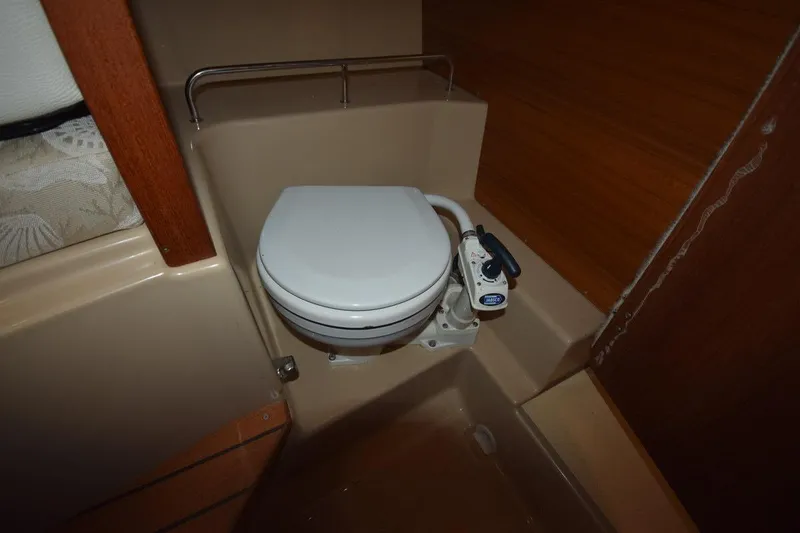 Slide: The Image of 2018 Ranger Tugs R-23 boat interior with compact marine toilet. - 47
