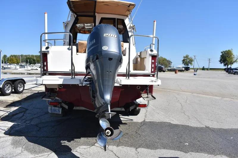 Slide: The Image of 2018 Ranger Tugs R-23 boat with Yamaha 200 outboard motor, parked on a trailer. - 6