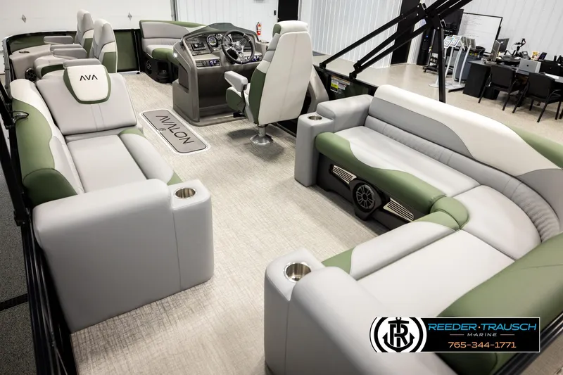 Slide: The Image of 2026 Avalon LSZ EL pontoon boat interior with luxurious seating and modern dashboard. - 11