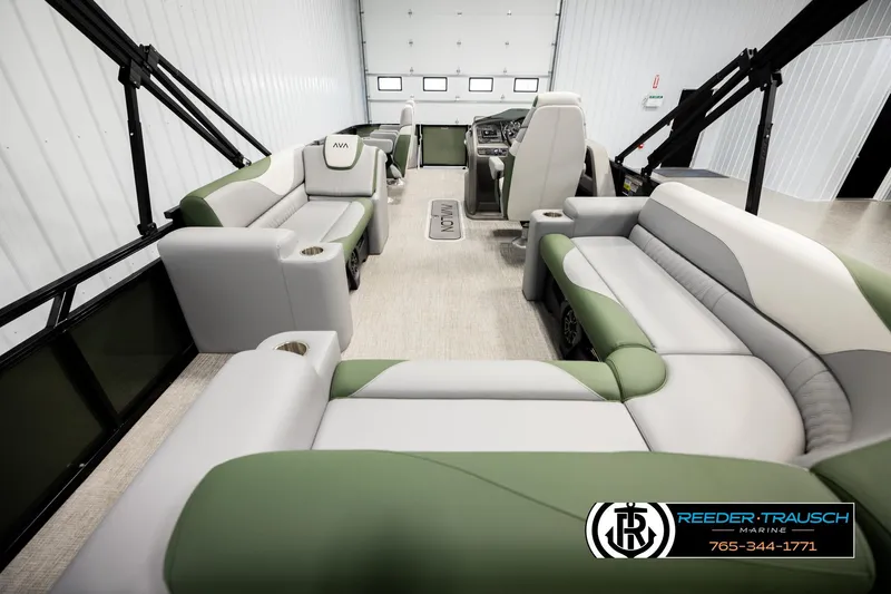 Slide: The Image of Luxurious 2026 Avalon LSZ EL pontoon boat interior with plush seating and modern design. - 16