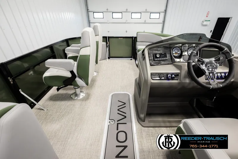 Slide: The Image of Interior of 2026 Avalon LSZ EL pontoon boat with modern helm and seating. - 17