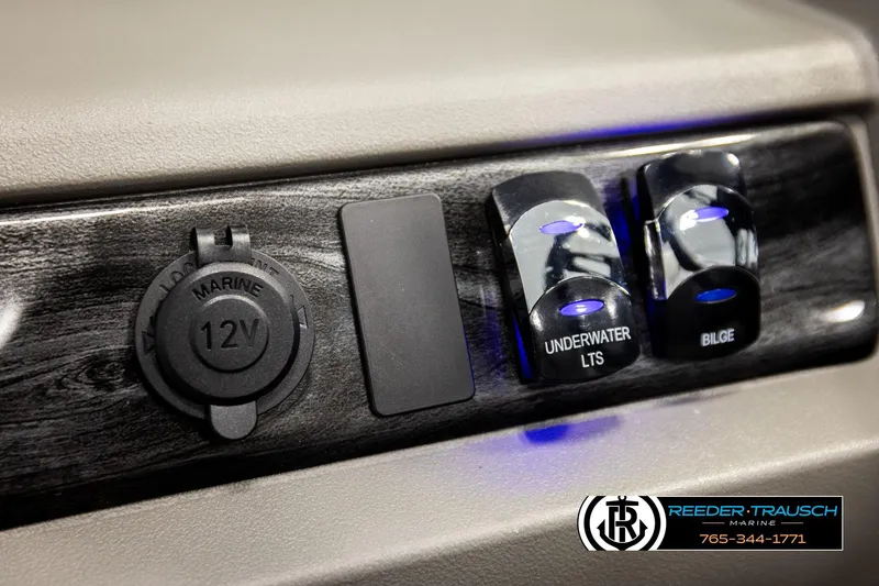 Slide: The Image of 12V marine outlet and switches on 2026 Avalon LSZ EL boat dashboard. - 30