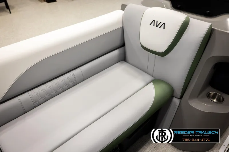 Slide: The Image of Luxurious Avalon LSZ EL 2026 boat seating with green and white upholstery, featuring cup holder. - 37