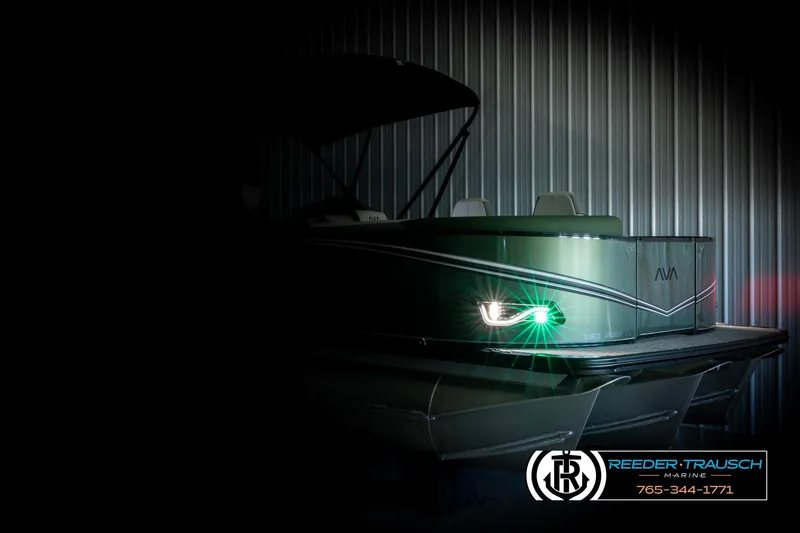 Slide: The Image of 2026 Avalon LSZ EL pontoon boat with illuminated headlight in a dimly lit setting. - 4