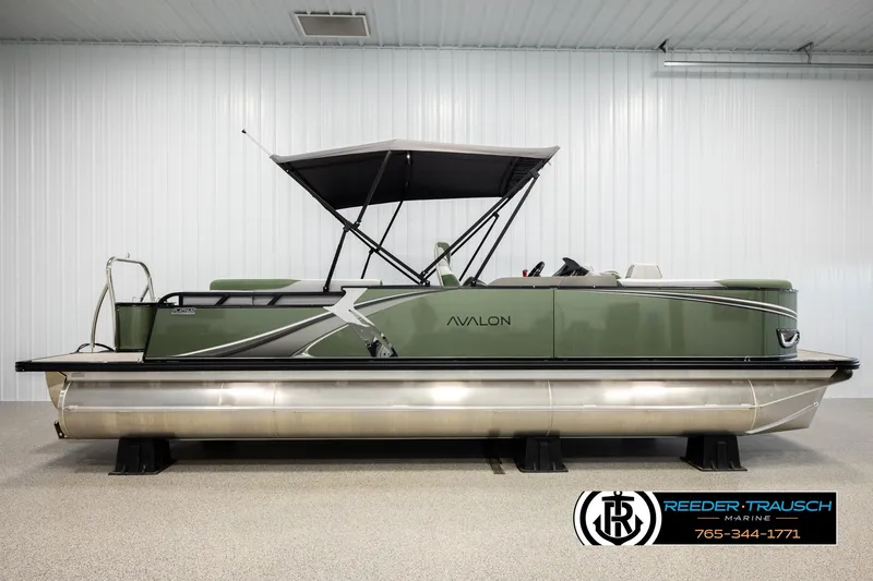 Slide: The Image of 2026 Avalon LSZ EL pontoon boat with canopy in showroom, side view. - 5