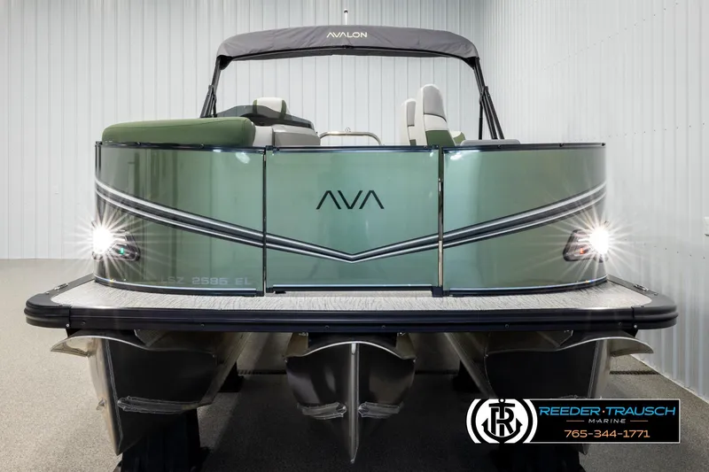 Slide: The Image of 2026 Avalon LSZ EL pontoon boat with sleek design and illuminated front lights. - 8