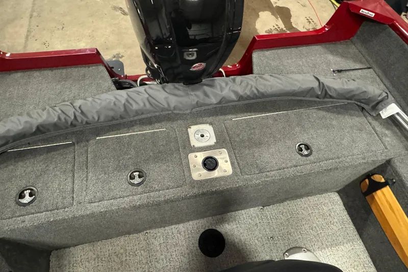 Slide: The Image of 2023 Tracker Pro Guide V-175 WT boat interior with motor and storage compartments. - 13