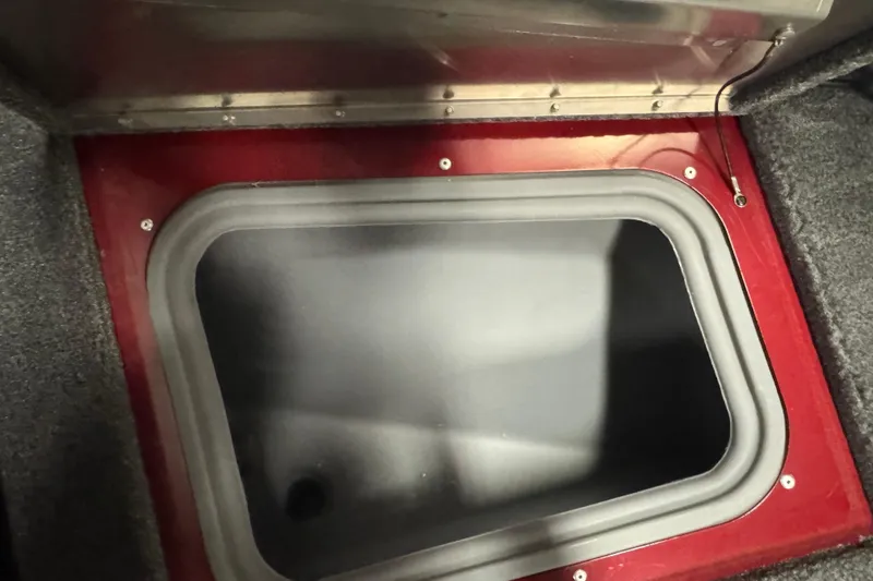 Slide: The Image of Open storage compartment in 2023 Tracker Pro Guide V-175 WT boat. - 18