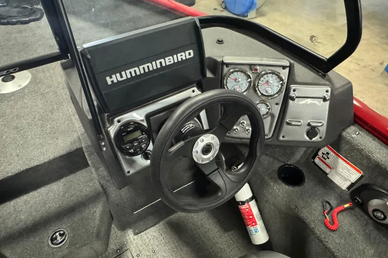 Slide: The Image of 2023 Tracker Pro Guide V-175 WT boat dashboard with steering wheel and Humminbird electronics. - 6