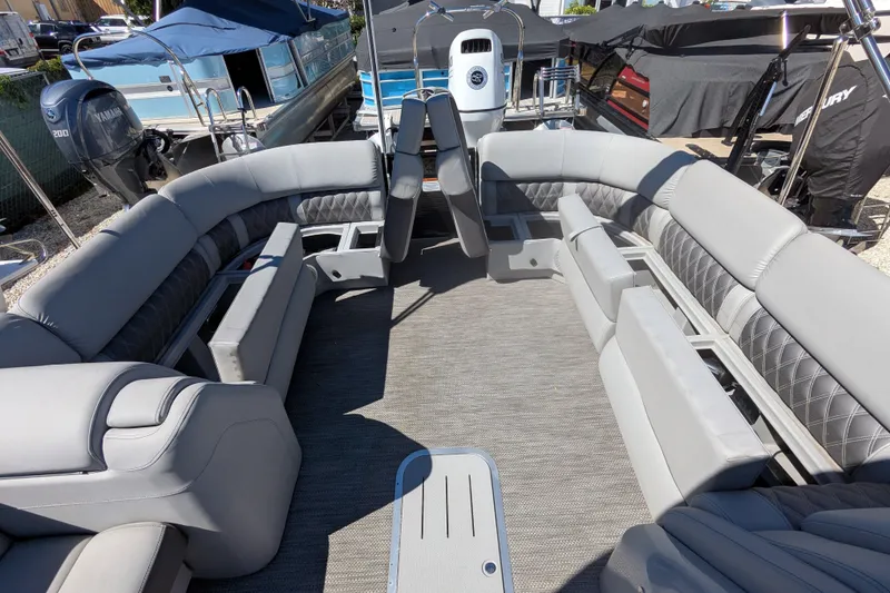 Slide: The Image of 2023 Bennington R 27 RSRAX2 pontoon boat with luxurious seating and modern design. - 12