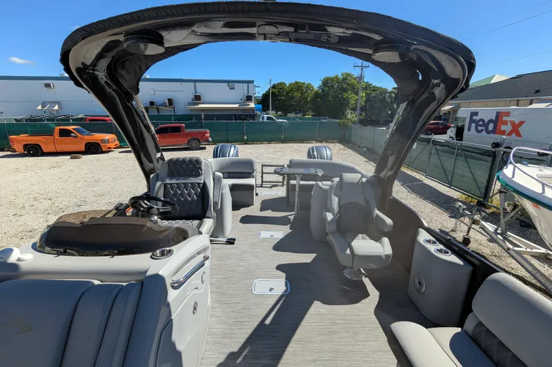 Slide: The Image of 2023 Bennington R 27 RSRAX2 pontoon boat with luxurious seating and modern design. - 17