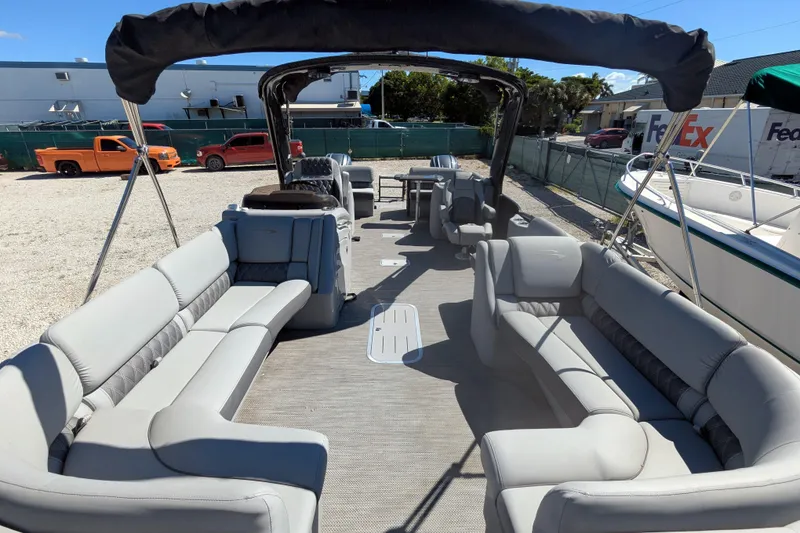 Slide: The Image of 2023 Bennington R 27 RSRAX2 pontoon boat with spacious seating and canopy. - 20