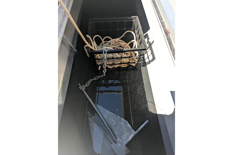 Slide: The Image of Storage compartment of 2023 Bennington R 27 RSRAX2 with anchor and rope. - 22