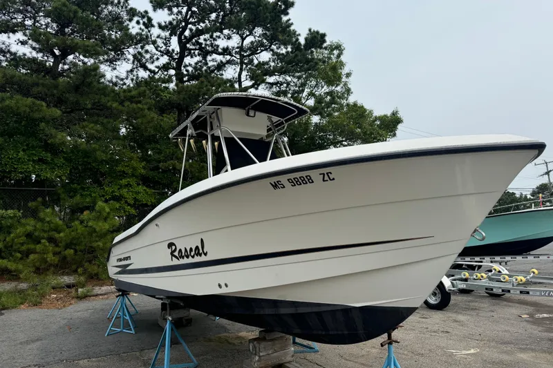 The Image of 2004 Hydra-Sports Vector 2400 CC boat on stands, surrounded by trees. - 0