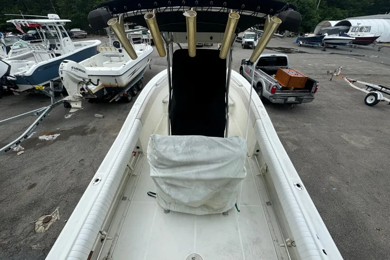 Slide: The Image of 2004 Hydra-Sports Vector 2400 CC boat in a marina, surrounded by other boats and vehicles. - 7