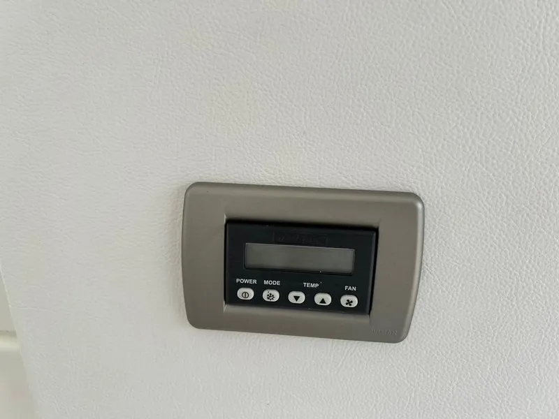 Slide: The Image of Control panel on 2019 Sea Ray Sundancer 350 Coupe boat interior wall. - 13