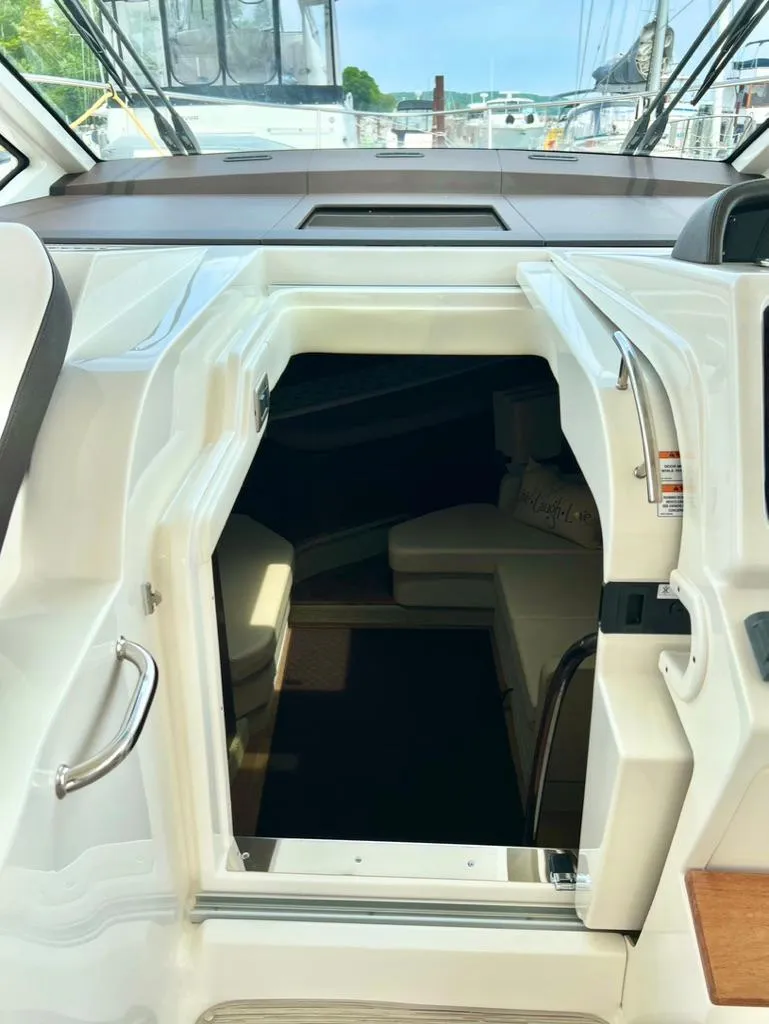 Slide: The Image of 2019 Sea Ray Sundancer 350 Coupe cabin entrance with sleek interior design. - 24