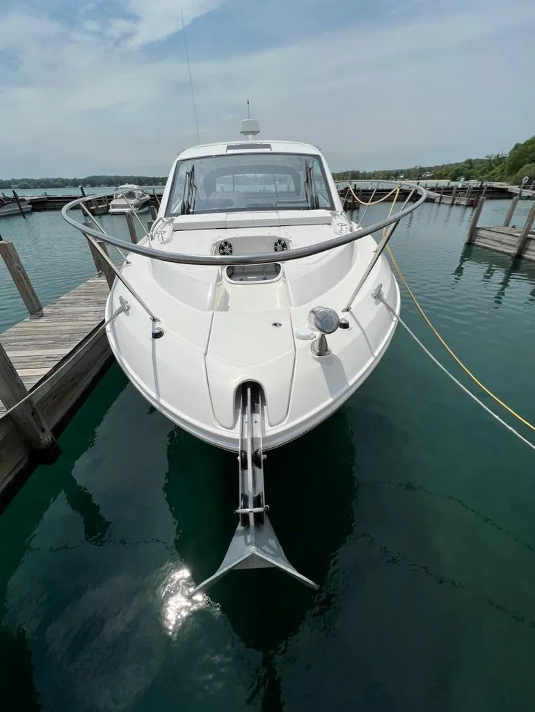 Slide: The Image of 2019 Sea Ray Sundancer 350 Coupe docked in a marina. - 3