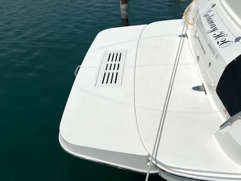 Slide: The Image of 2019 Sea Ray Sundancer 350 Coupe's swim platform on calm water. - 9