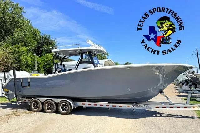 Slide: The Image of 2023 Tidewater 320 CC Adventure boat on trailer at Texas Sportfishing Yacht Sales. - 0