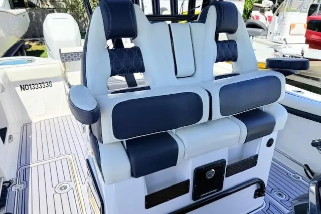 Slide: The Image of 2023 Tidewater 320 CC Adventure boat seating with modern design and comfortable upholstery. - 11