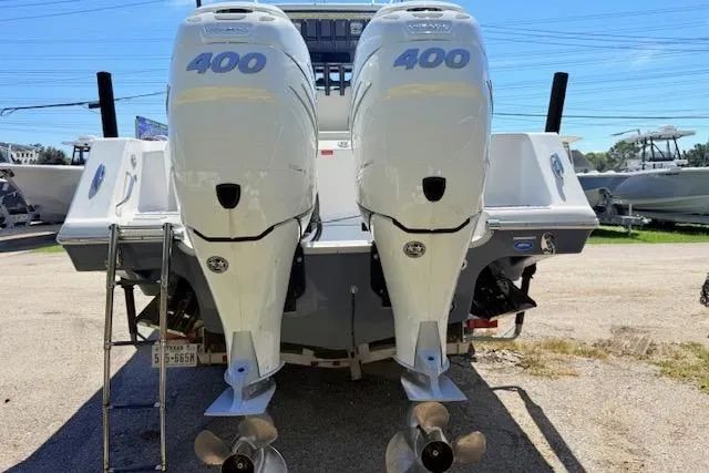 Slide: The Image of 2023 Tidewater 320 CC Adventure with dual 400 horsepower engines, rear view. - 2