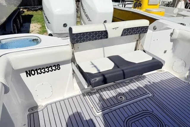 Slide: The Image of 2023 Tidewater 320 CC Adventure boat with foldable seating and registration number NO1333338. - 5