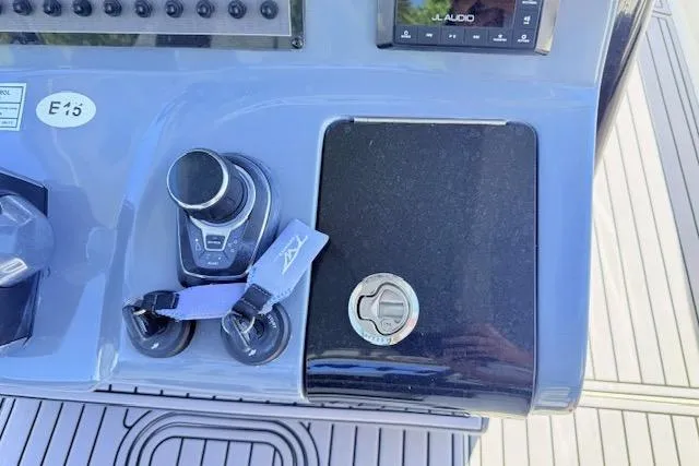 Slide: The Image of Control panel of 2023 Tidewater 320 CC Adventure boat with joystick and controls. - 9