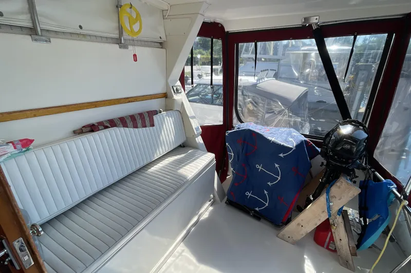 Slide: The Image of 1989 Jefferson 37 Sundeck boat detail with Victory logo and red trim. - 12