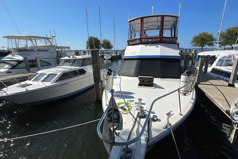 Slide: The Image of Interior of 1989 Jefferson 37 Sundeck yacht with helm, seating, and decor. - 2