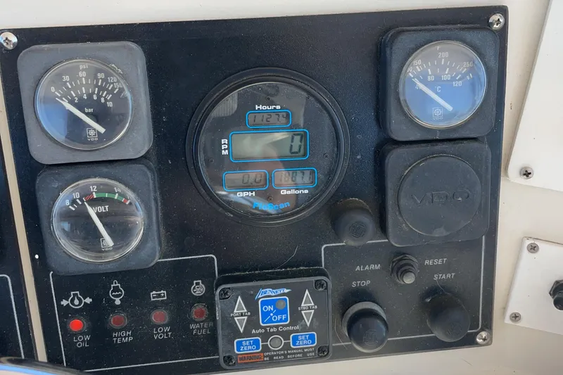 Slide: The Image of Control panel of a 1989 Jefferson 37 Sundeck boat with navigation equipment. - 21