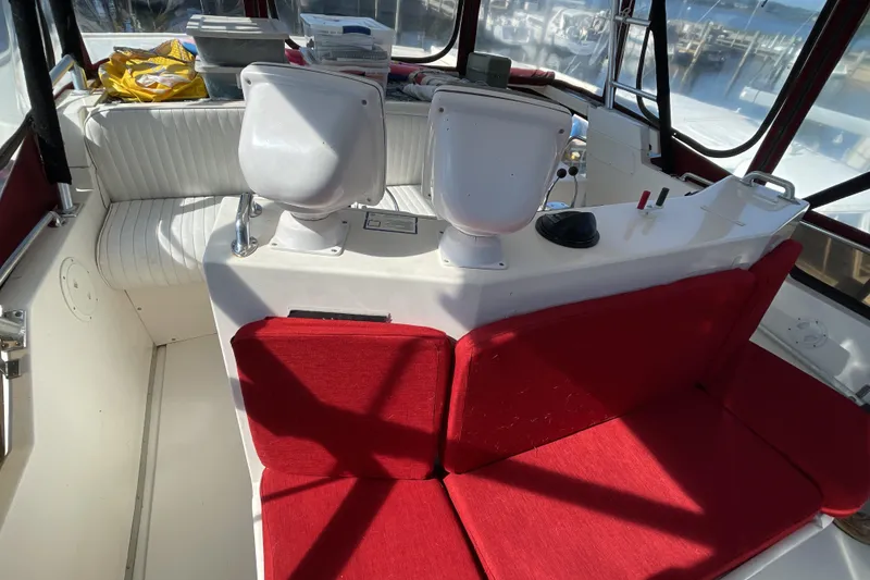 Slide: The Image of Control panel of a 1989 Jefferson 37 Sundeck boat with audio system and bilge pump switches. - 22