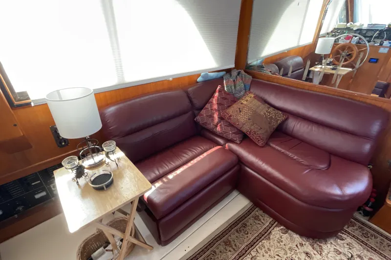Slide: The Image of 1989 Jefferson 37 Sundeck helm with wooden wheel and navigation instruments. - 28