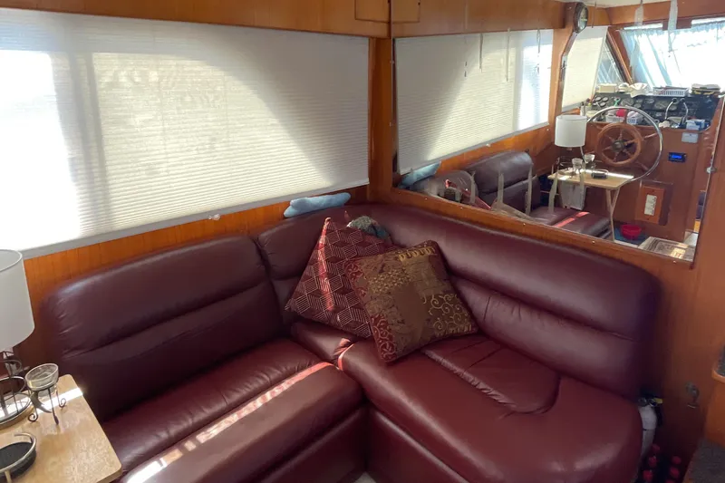 Slide: The Image of Luxurious interior of 1989 Jefferson 37 Sundeck with leather sofa and decorative pillows. - 29