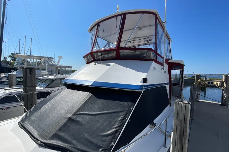 Slide: The Image of Interior of 1989 Jefferson 37 Sundeck boat with helm, steering wheel, and table lamp. - 3