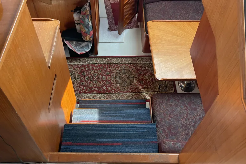 Slide: The Image of Luxurious maroon leather seating in 1989 Jefferson 37 Sundeck yacht interior. - 31