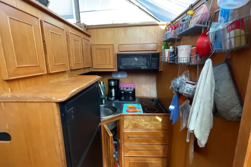 Slide: The Image of Cozy interior of 1989 Jefferson 37 Sundeck with dining area and decor. - 34