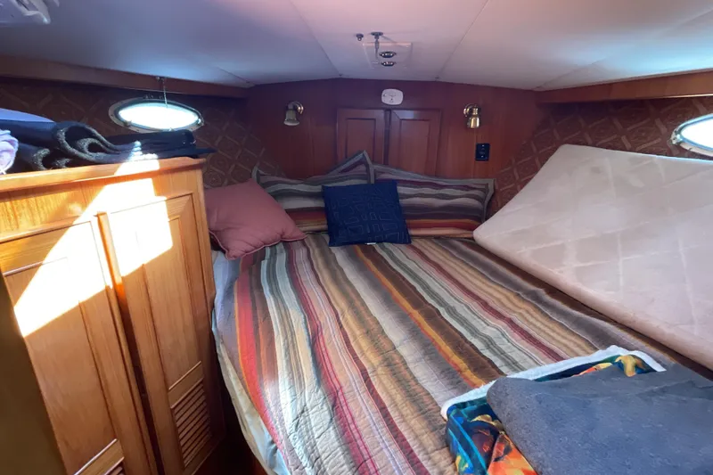 Slide: The Image of Compact kitchen in 1989 Jefferson 37 Sundeck boat with sink, stove, and appliances. - 39